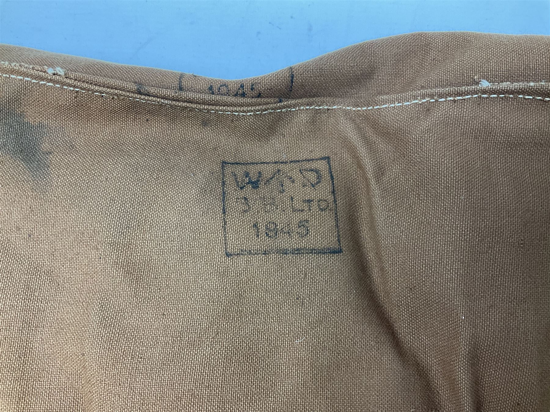 WW2 British Army RAMC 'Regimental Medical Pannier', well marked externally and dated 1941, stamped May 1943 internally, canvas covered wicker form with leather edges, hinged top and fall front with two rope carrying handles, fitted iron locking straps with securing chains; contains various unused field dressings and bandages with WW2 dates and two pillows; original label under lid L79cm