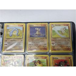Collection of Pokemon trading cards, mostly 1999 Wizards Pokemon cards to include holo Charizard 4/102, first edition holo Machamp 8/102, further holographic cards; Dark Flareon 35/82 and Dark Vaporeon 45/82, cards from themed sets and 4th edition prints; 1998 Electronic Pokédex with cardboard boxes for themed decks Blackout, Overgrowth and Power Reserve Jungle, along with a large quantity of energy and trainer cards 