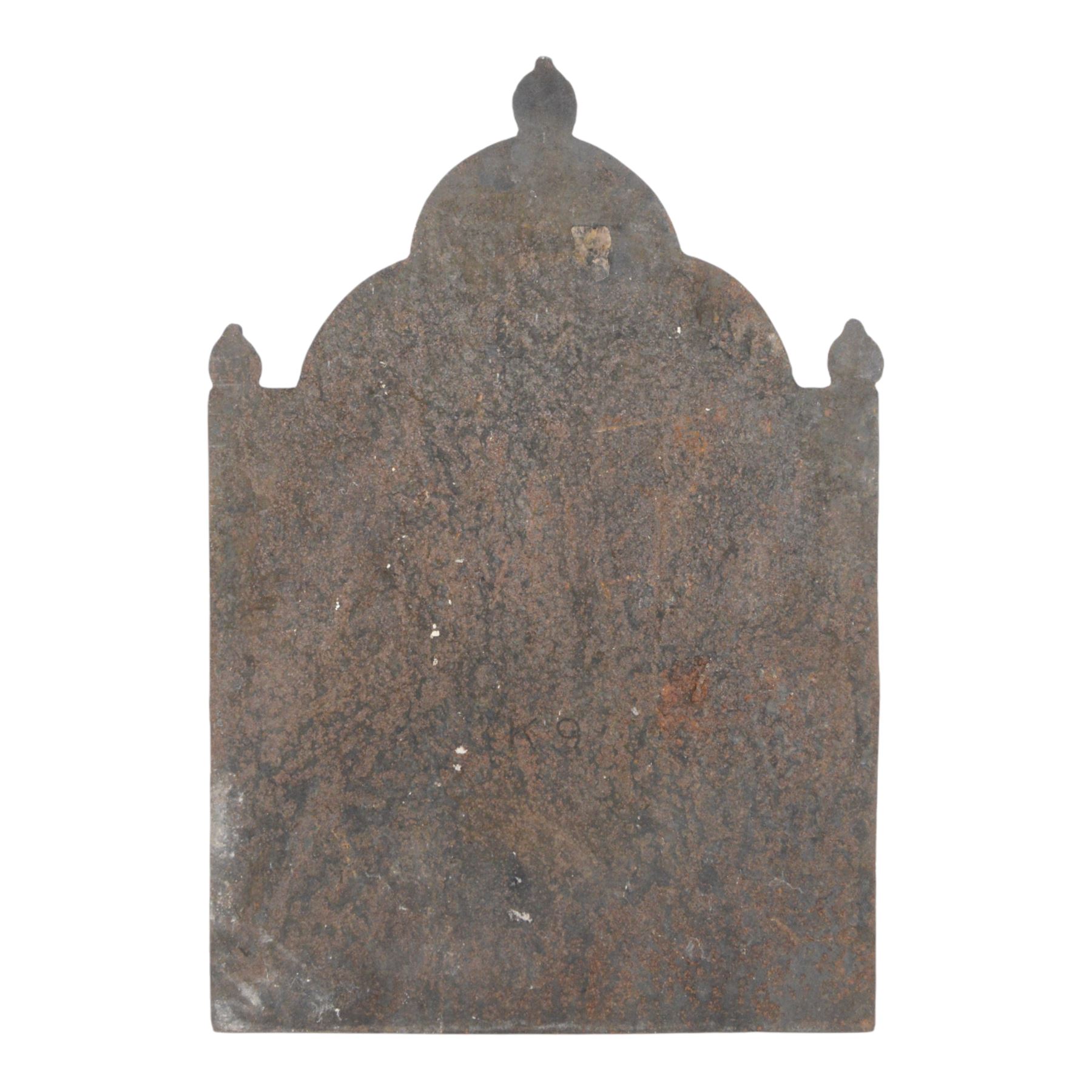 Cast iron fire back, depicting a couple under a tree with three acorn finials, H74cm