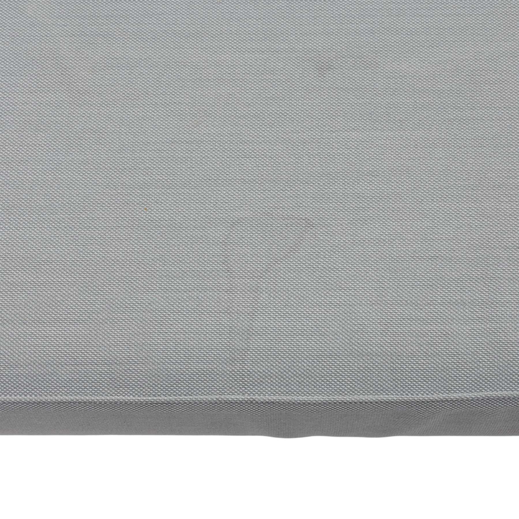 Fritz Hansen - 'Favn' sofa, designed by Jaime Hayon (1974-), upholstered in light grey fabric, the organic curved back and integrated arms enclosing loose seat and back cushions, raised on slender cylindrical metal supports