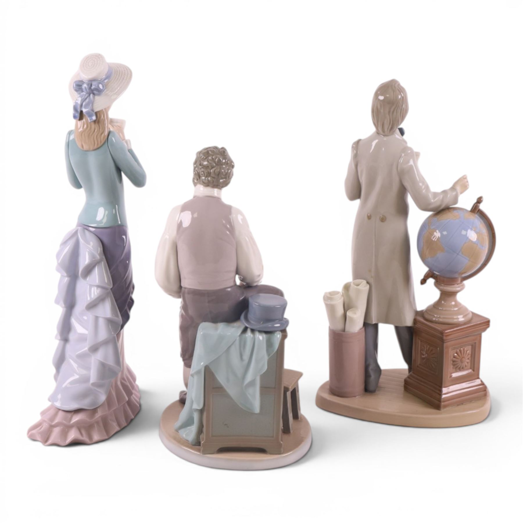 Three Lladro figures, comprising The Professor 5208, Artistic Endeavour 5234 and Reading 5000