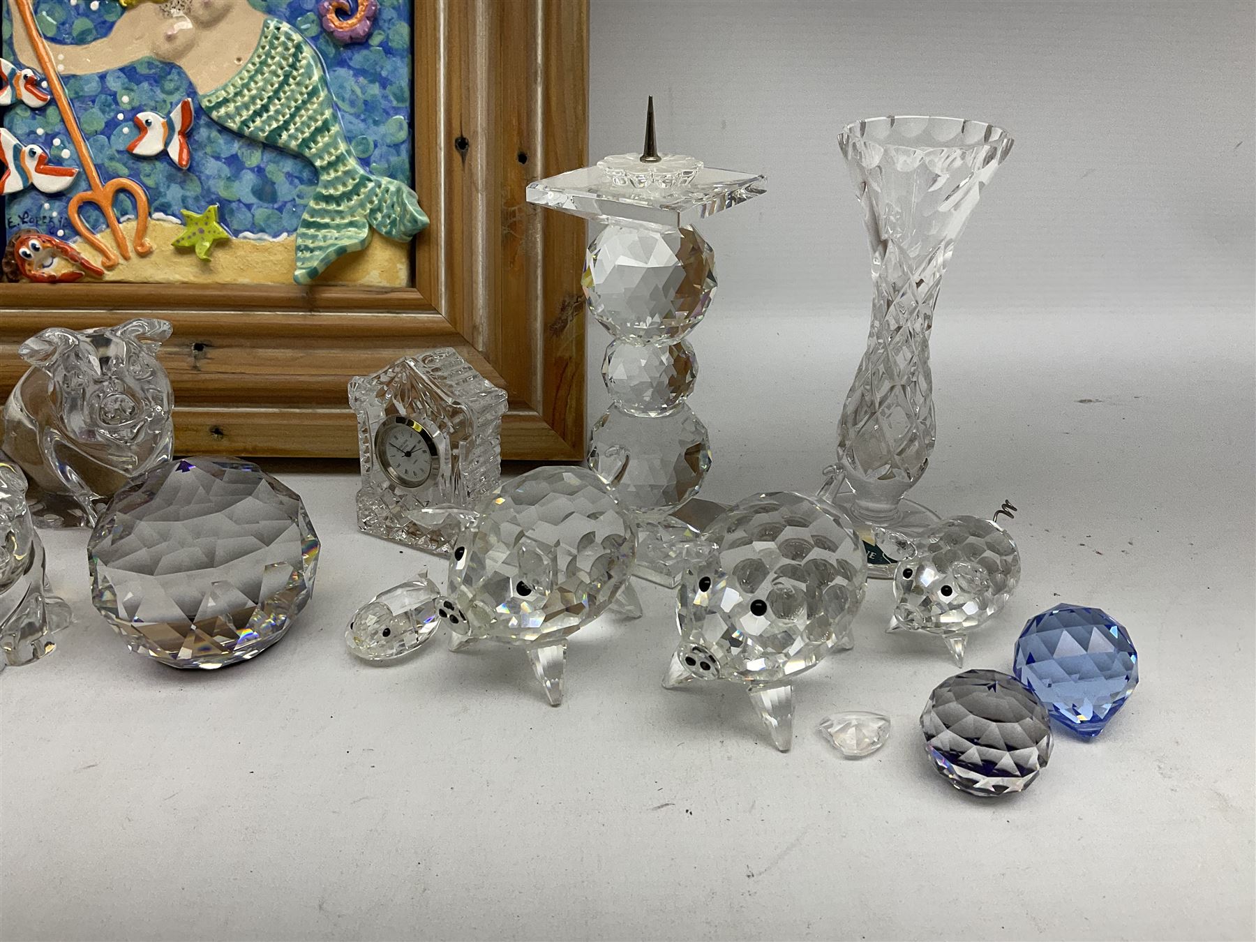Collection of glass figures and ornaments, to include Waterford pig, Wedgwood pig, Swarovski paperweights etc, together with a £D ceramic of King Neptune 