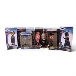 Eleven Neca Head Knockers, comprising The Joker, Batman, three Spider Man, Terminator 2 T-...