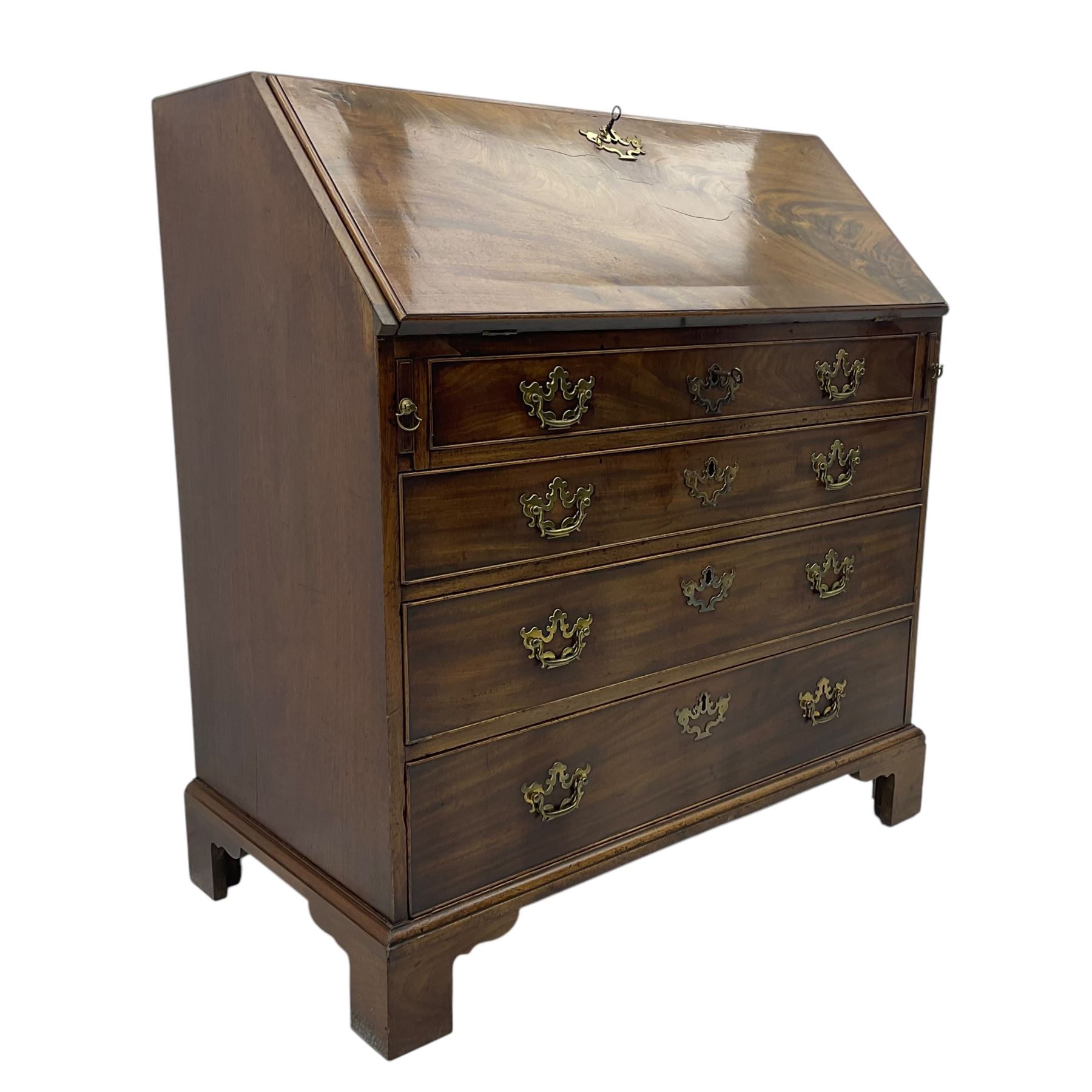 George III mahogany bureau, fall-front enclosing a fitted interior of drawers, pigeonholes and central mirrored cupboard, over four graduated cockbeaded drawers with brass batwing handles, raised on bracket feet
