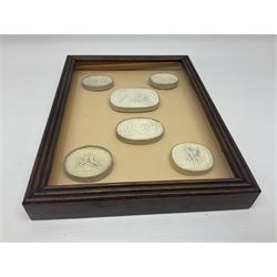 Set of six 19th century Grand Tour plaster intaglios, each depicting classical figures, frame H25cm, W19cm