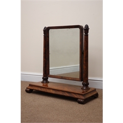  William lV figured mahogany toilet mirror, upright rectangular plate on tapering column supports with lotus carved finials, moulded platform base on scroll feet, W71cm, H71cm, D30cm  
