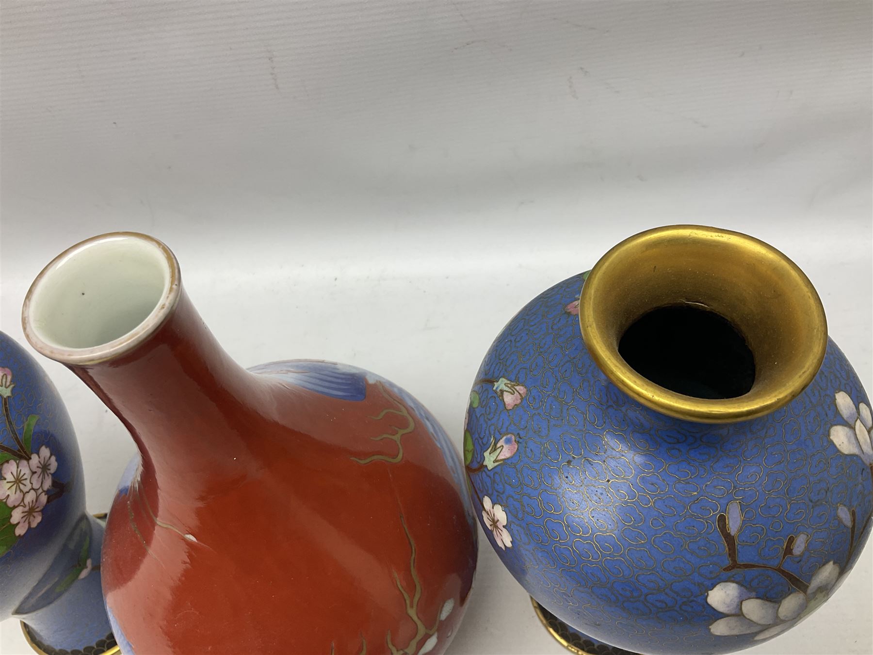 20th Century Japanese vase decorated with a blue dragon and gilding upon red yellow ground, bears Fukagawa Seiji mark (a/f), together with pair of blue cloisonné vases of baluster form decorated with blossom, and pair of Japanese vases, tallest H26cm