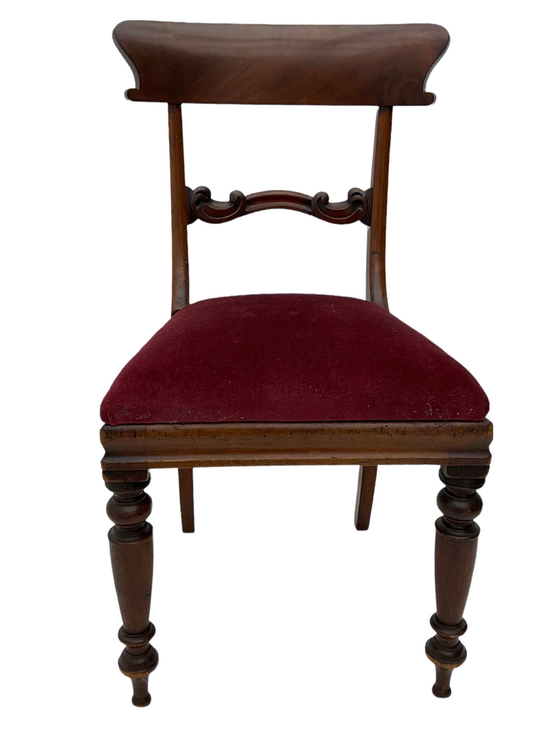 Seven early 19th century mahogany dining chairs - set six side chairs with scroll carved middle rails (W46cm), and a carver elbow chair with rope twist middle rail