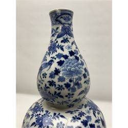 19th century Chinese blue and white double gourd form vase, decorated with blooming peonies and birds in flight, H36cm