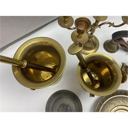 Four brass pestle and mortars, to include two miniature examples, together with other brassware including four branch candleabra, bells etc