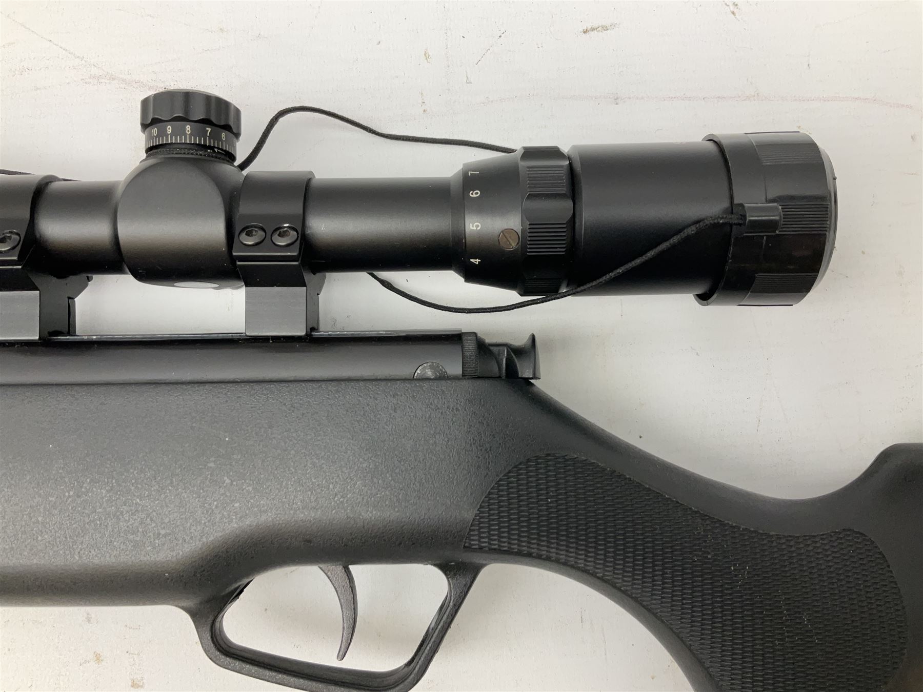 Stoegar .177 air rifle with break barrel action, 3 x 9 telescopic sight and fully integrated sound moderated barrel, no visible serial number, L109cm; in Stoeger lined gun sling