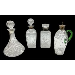 Four silver mounted decanters, comprising cut glass ships decanter and stopper, hallmarked Birmingham 1976, dimpled decoration decanter with green glass handle, hallmarked Birmingham 1910 and two other examples, both hallmarked, tallest example H28cm 