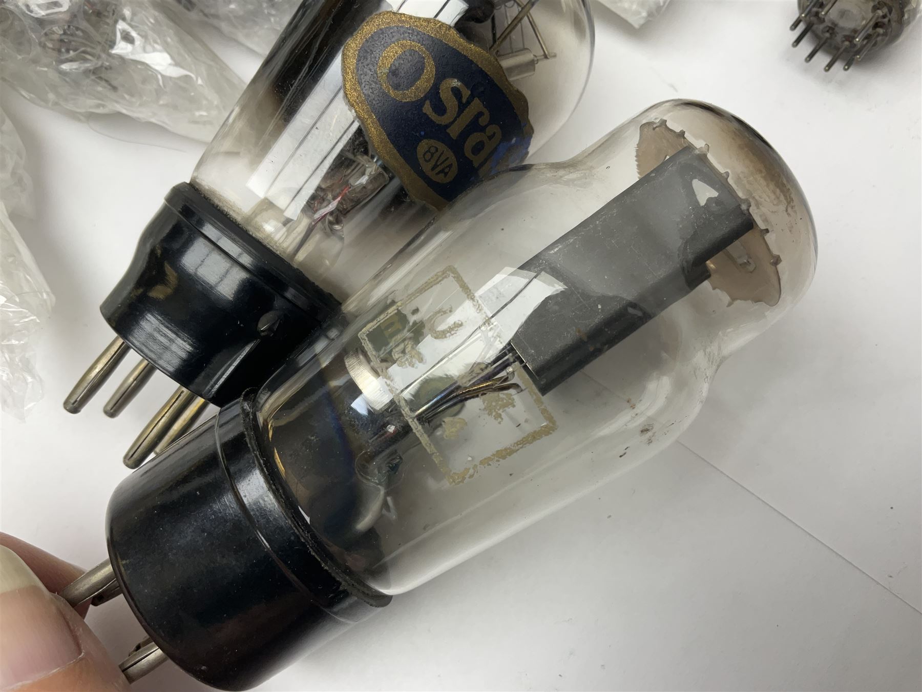 Collection of Osram, Elpico, Sylvania and similar thermionic radio valves/vacuum tubes, including P2, L21, DH77 GK9, U14 and PCLl86, approximately 19 as per list, unboxed