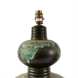 West German Pottery - two mid 20th century ceramic lamp bases, brown glaze with petal style decoration and pierced detail, together with another similar with volcanic glaze, largest H52cm