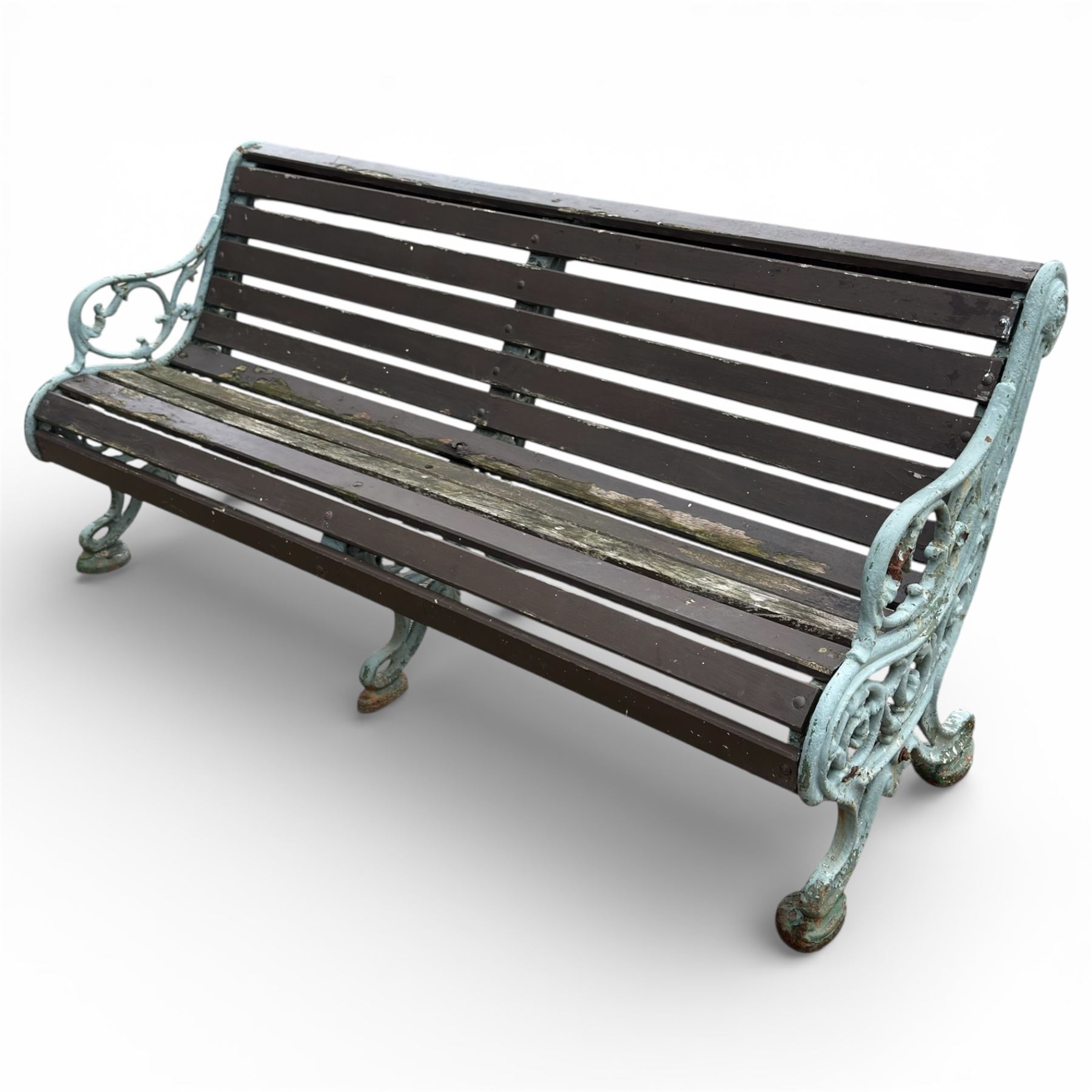Victorian cast iron garden bench with dark wooden slats and ornate green painted ends.