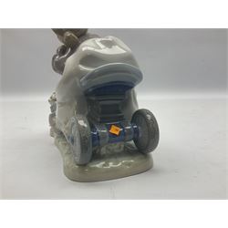 Lladro figure, In No Hurry, modelled as a girl on a tricycle, sculpted by Francisco Polope, with original box, no 5679, year issued 1990, year retired 1994, H15cm