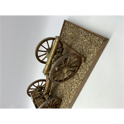 Wooden and brass scale model of a c1815 Napoleonic Field Gun with limber, brass barrel with ammunition boxes, on metal bound wooden spoked wheels on gravelled rectangular base L74.5cm D26cm H18cm