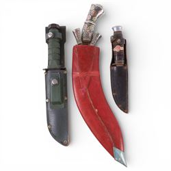 Whitby & Co Commando style knife with scabbard and sharpening stone, together with two other knives 