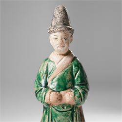 Pair of Chinese terracotta court attendant tomb figures,  probably Ming Dynasty, in Sancai green glaze, upon stepped square bases, H22cm 