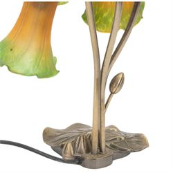 Art Nouveau Tiffany style table lamp, the bronzed base modelled as lily pads leading to tendrils and three branches supporting green and yellow glass lily flower shades, H42cm