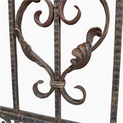 Victorian wrought iron vineyard gate, with ornate scrollwork and foliate acanthus leaf decoration, shaped cresting and central decorative panel, finished in rustic black painted finish
