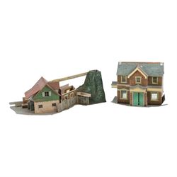 Collection of model railway locomotives, track and accessories, including Mettoy tin plate clockwork 0 gauge locomotive, tender and three coaches, boxed Hornby 00 gauge Thomas the Tank engine locomotive and two wagons, loose 00 gauge rolling stock and track and some kit built buldings, etc