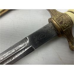 WW2 German kreigsmarine style dagger composed from various age parts, the post-war 25cm double fullered blade  with etched decoration and inscribed WKC with knight's head; in gilt brass scabbard with two rings L42cm overall
