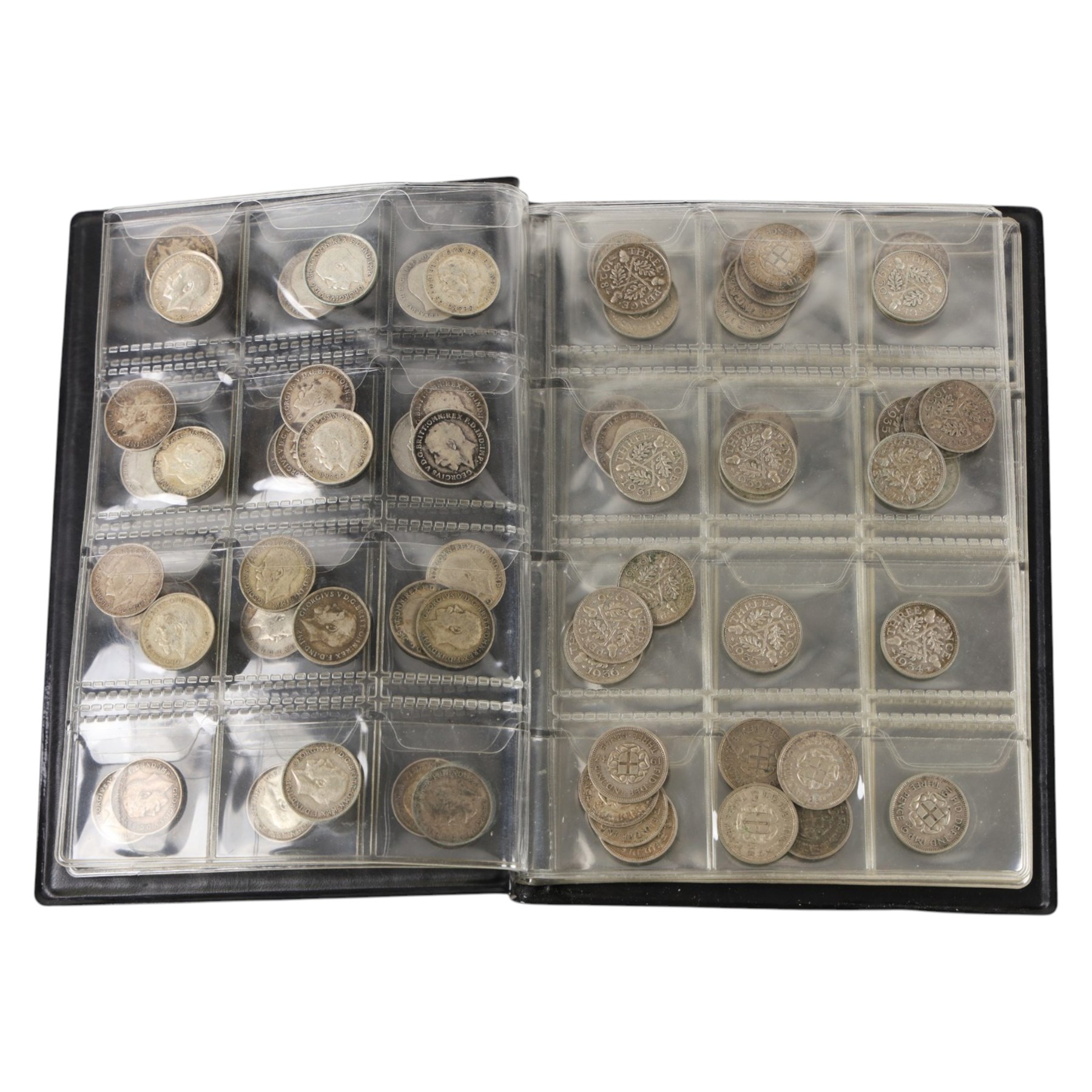 Approximately thirty-two Great British pre-1920 and approximately forty Great British pre-1947 silver threepence coins, in black folder