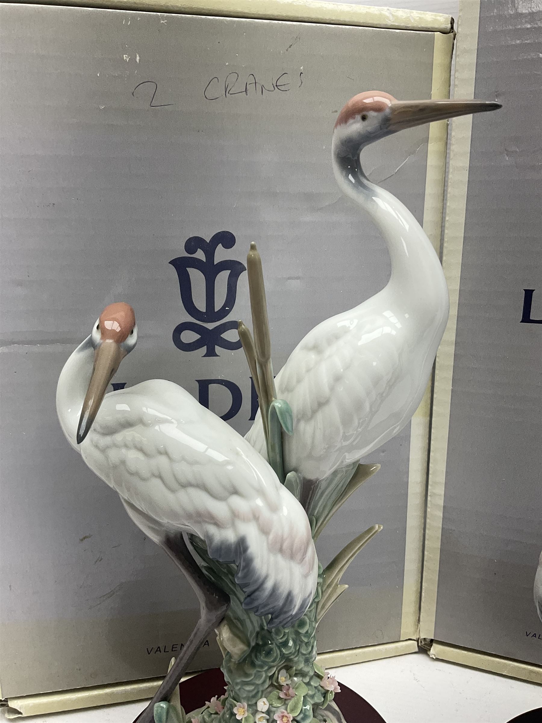 Two boxed Lladro figures, comprising courting cranes no 1611 and dancing crane no 1614, both with original boxes 