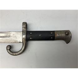 Turkish Model 1874 sword bayonet with 57.5cm curving steel fullered blade and chequered black grip, in steel mounted leather scabbard L75.5cm overall