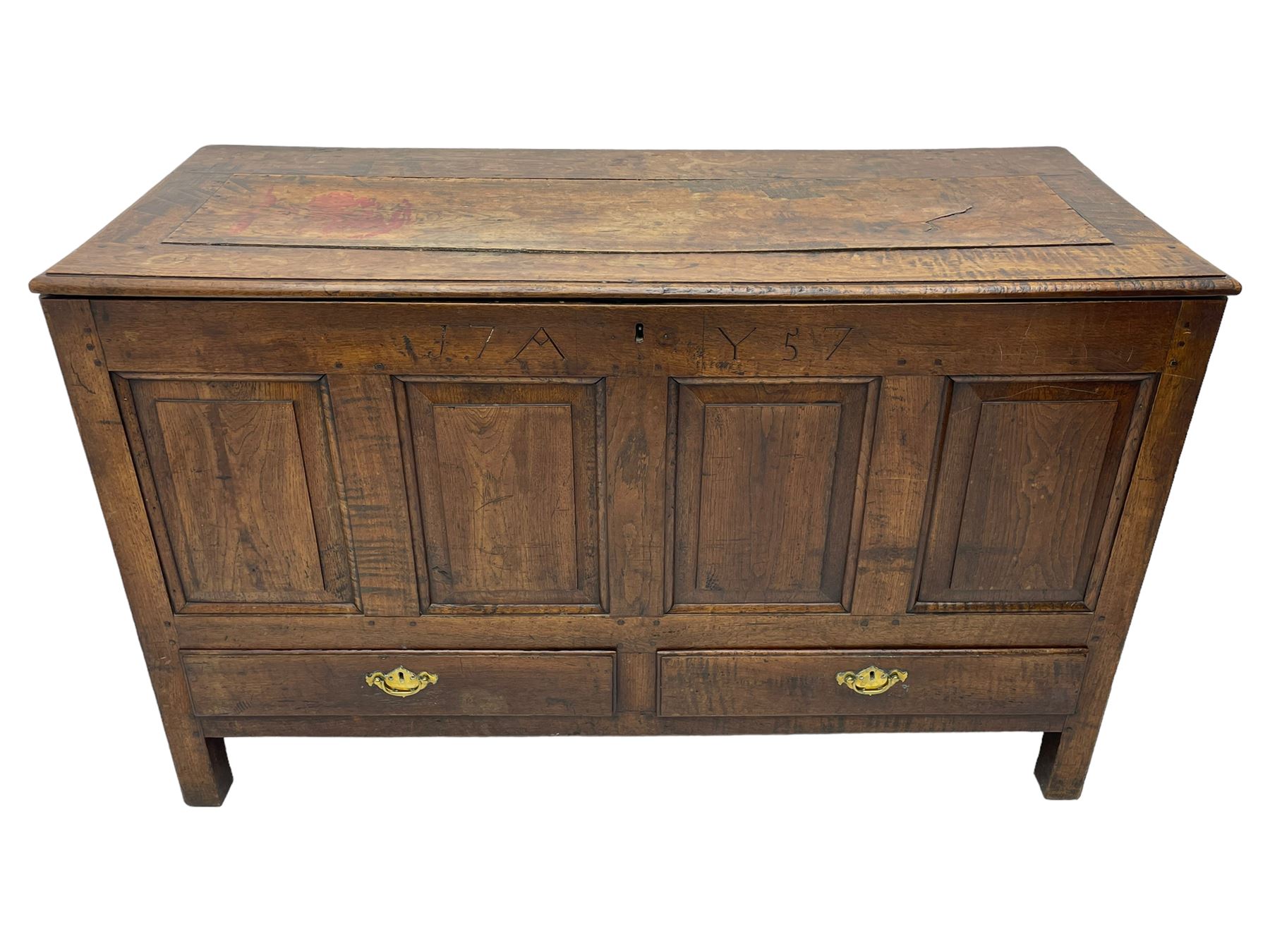 Georgian oak mule chest, moulded rectangular hinged lid over quadruple fielded panel front, the frieze inscribed '17 A Y 57', fitted with two drawers, panelled ends and back, on stile supports