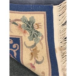  Chinese blue ground rug, central medallion, repeating border, 246cm x 154cm  