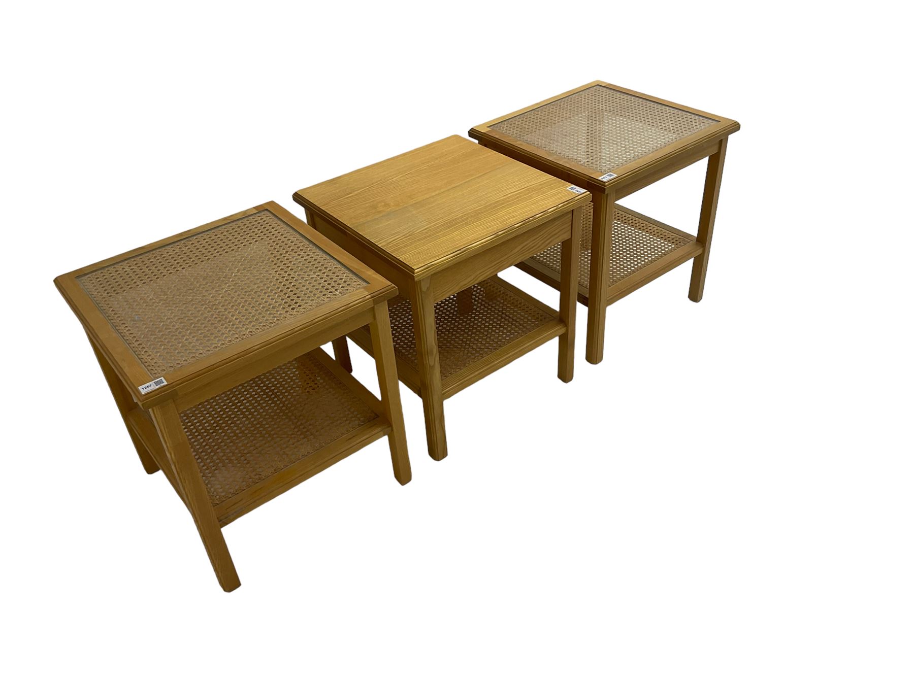 Pair beech bedside tables, square top with canework inset and cane under-tier, together with another similar 
