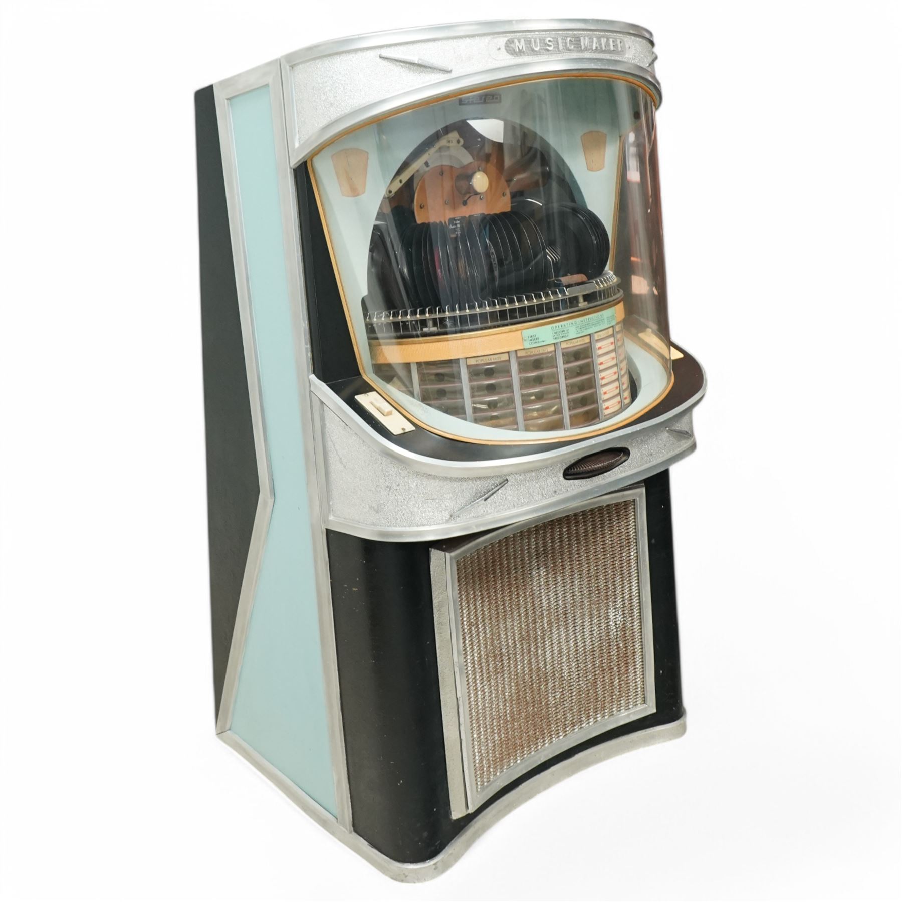 Ditchburn - 'Music Maker Panoramic 200' jukebox circa 1959, curved panoramic glazed front offering full view of the automatic selection process, accommodating 100 records (200 selections), with a stereo sound system, the aluminium trim over a woven speaker grille with an all-over ebonised and silver finish