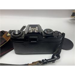 Four camera bodies, to include, Ricoh KR-10 serial no. 38826, Pentax MZ-M serial no. 4185969 with 'SMC Pentax- M 1:3.5 28mm' lens, Canon EOS500 serial no. 080927, with 'Sigma Zoom 100-300mm 1:4.5-6.7 DL'  lens etc, with other camera lenses and equipment 