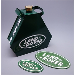  Modern Landrover green painted tin petrol can of triangular form with brass cap H34cm and two graduated oval cast iron Landrover signs, largest L25cm (3)  