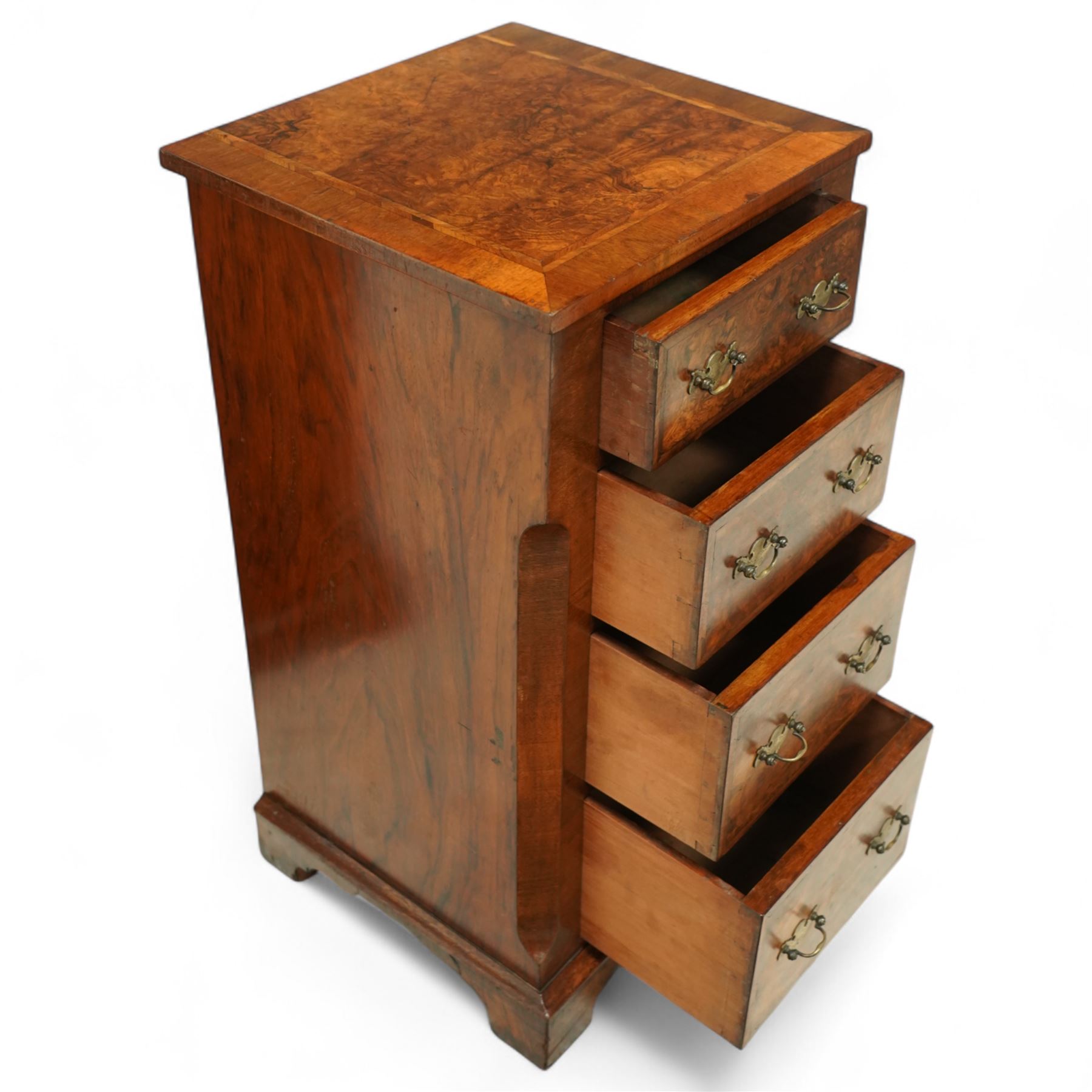 Pair of Victorian inlaid burr walnut small size chests,  rectangular top in burr walnut and crossbanded with herringbone inlay and chamfered sides with four graduated inlaid burr walnut drawers and engraved cut brass handles and mahogany drawer linings, supported on moulded bases with shaped bracket feet, circa 1870