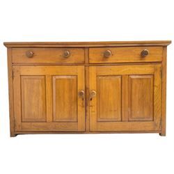 JAS Brister & Co Ld - Mid-20th century teak sideboard, fitted with two drawers over two panelled cupboards, stamped 'JAS. Brister & Co Ltd., Complete House Furniture, Port Elizabeth'