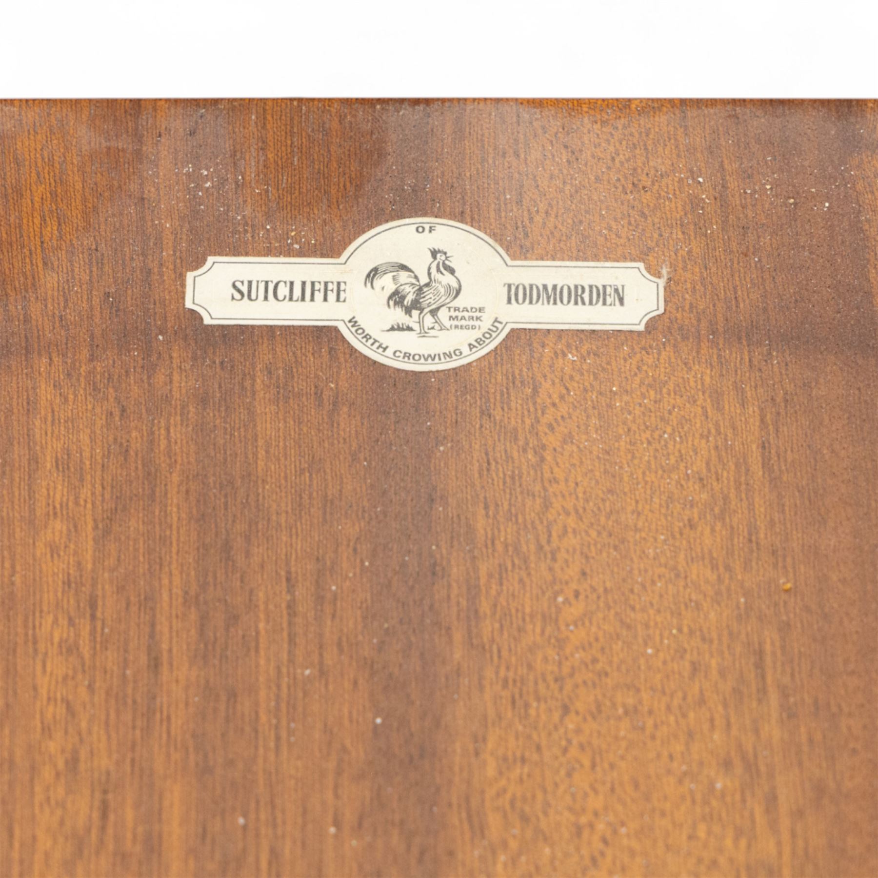 Sutcliffe of Todmorden - mid 20th century ‘S-Form’ teak dining table and chairs, the circular storable extending table with plain veneered top on tapered supports, together with matching dining chairs upholstered in black vinyl, with curved slat backs and shaped front supports, reflecting the sleek organic styling characteristic of 1960s British modern furniture design (Chairs H 93cm, W 46cm, D 46cm) (Extended 168cm)