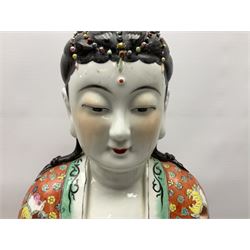 Tall Chinese polychrome figure of Guanyin (Guan Yin), the Goddess of Mercy and compassion, the Bodhisattva modelled seated and holding a rosary donning elaborate floral robes and beads, with four character seal marks beneath, H53cm