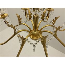 Gilt metal and glass mounted eight branch acanthus chandelier, the shaped stem with eight scrolling branches with glass drip tray bowls and leaf decoration joined with glass beaded chains and glass drops, 