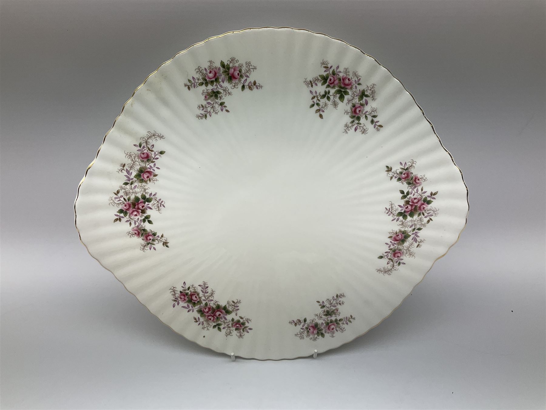 Royal Albert Old Country Roses pattern tea set, comprising teapot, coffee pot, six teacups and six saucers, five side plates, further teacup with joined saucer and side plate, open sucrier, milk jug, cake plate, and preserve pot and cover, together with Royal Albert Jubilee Rose pattern sauce boat and stand, and Royal Albert Lavender Rose pattern cake stand. 