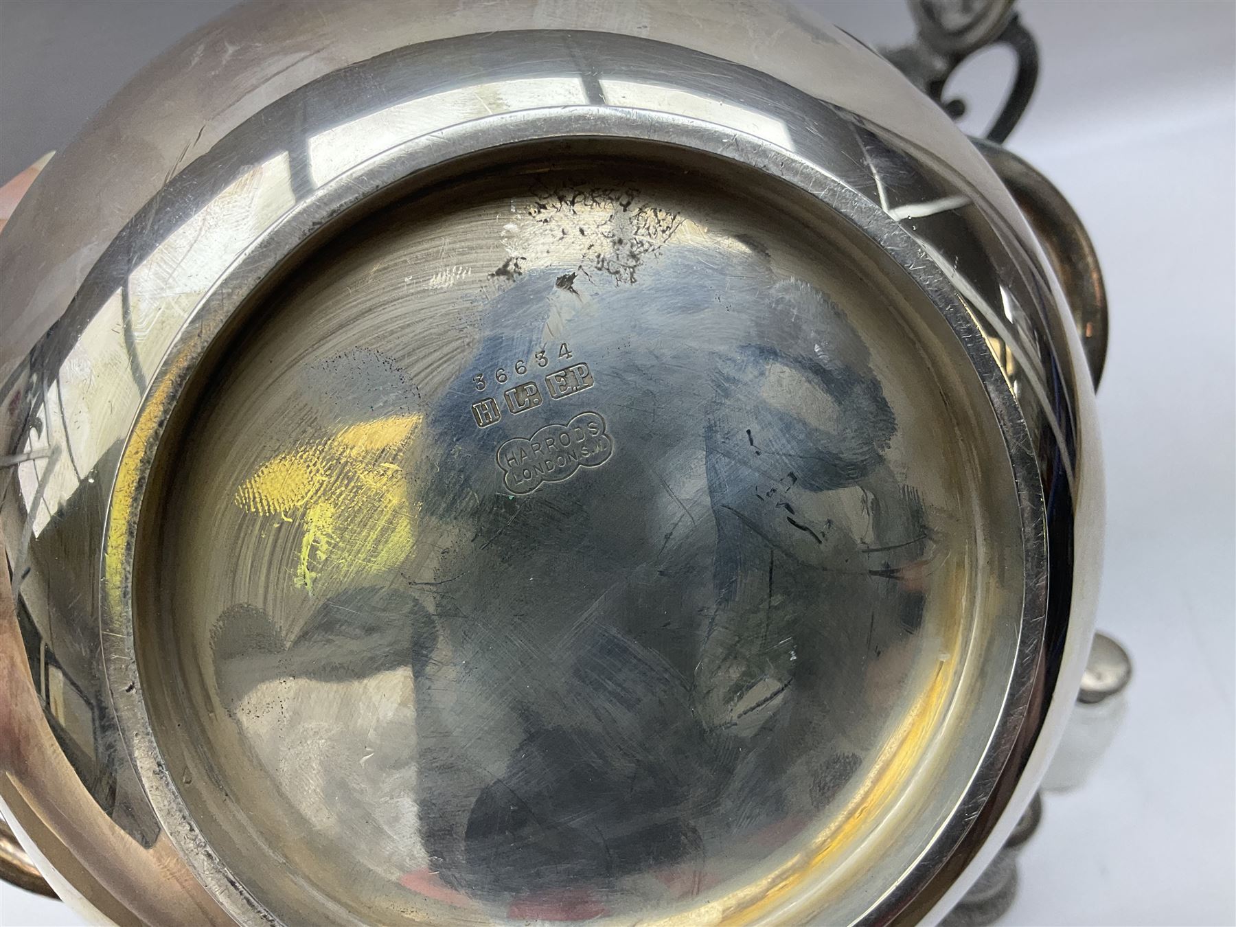 Twin handled silver plated bowl retailed by Harrods, together with two 19th century coffee pots, pewter milk jug and other metalware   
