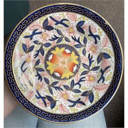 English porcelain Imari tea and coffee wares, pattern 1277, decorated with central orange floral motif surrounded by sprigs of yellow foliage within blue borders, comprising eleven teacups, eight coffee cups, twelve saucers, two shallow bowls and one finger bowl