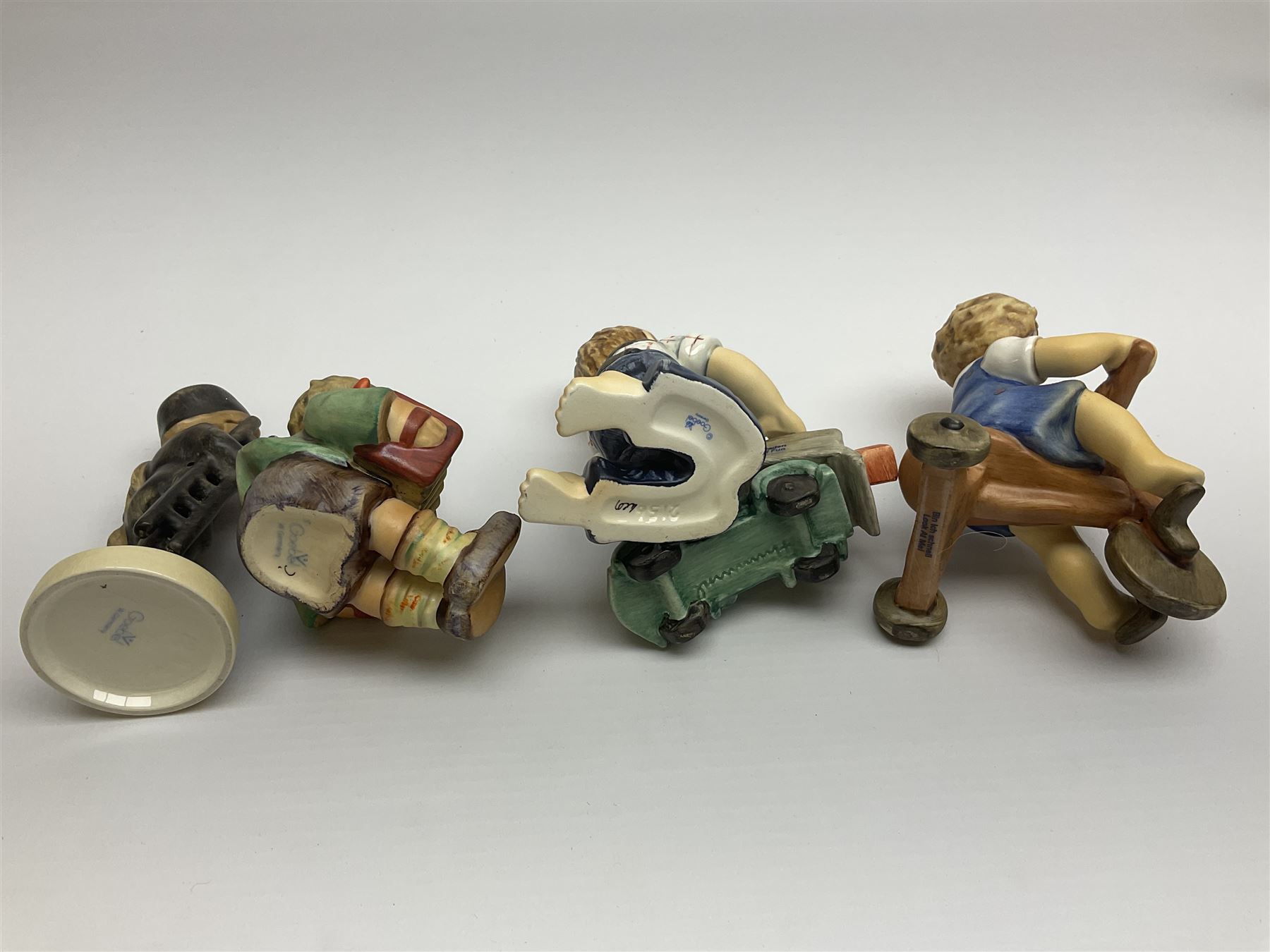 Twenty six Hummel figures by Goebel, to include Fire Fighter, Band Leader and Spring Sowing