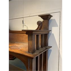 Late 19th century Arts & Crafts period oak mirror back sideboard, shaped bevelled mirror back carved with foliate scrolls and flower heads, down swept supports with elongated club-shaped uprights, moulded rectangular top over two drawers and three cupboards, the drawer fronts with copper handles decorated with sailing ships, panelled doors carved with mythical beasts, flowerheads and foliage, on moulded block feet