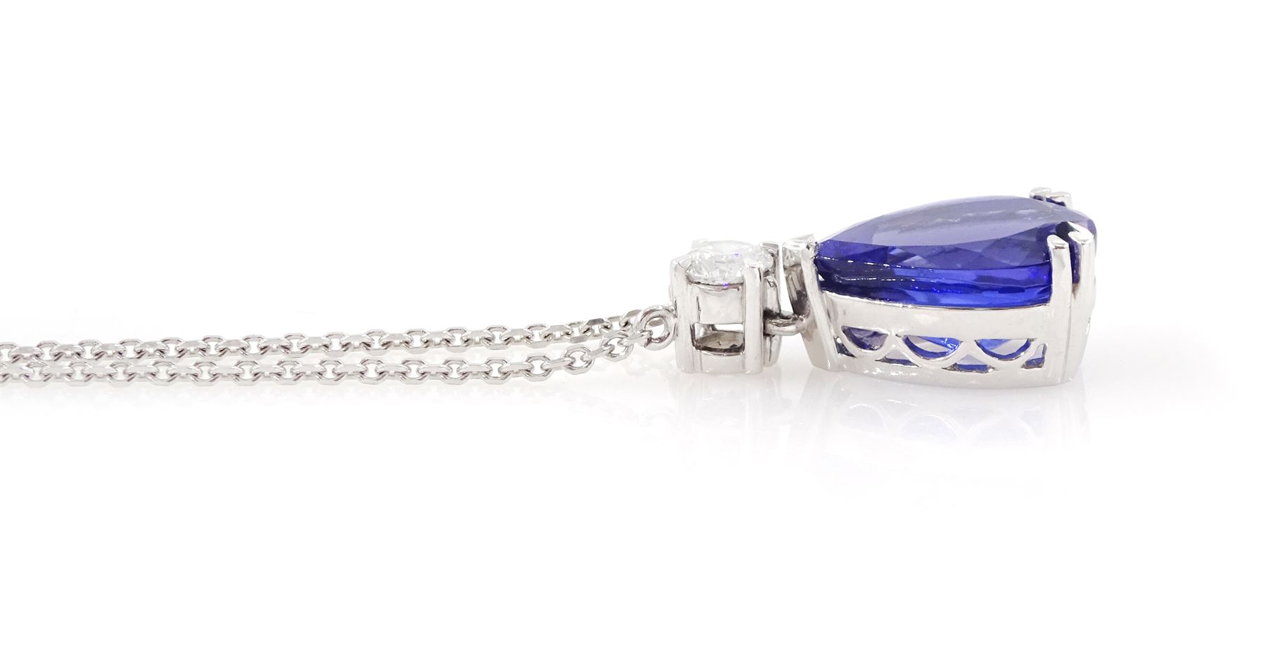 18ct white gold tanzanite and diamond necklace, single pear cut tanzanite of approx 7.60 carat, suspending from a single round brilliant cut diamond of approx 0.45 carat, to a fine belcher link chain necklace, hallmarked