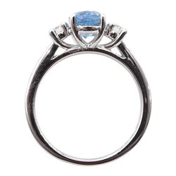 18ct white gold three stone oval aquamarine and round brilliant cut diamond ring, hallmarked, aquamarine approx  1.20 carat, total diamond weight approx 0.20 carat