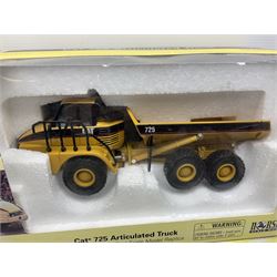 Four Joal Komatsu 1:50 scale die-cast models comprising WA600-3 Log Loader, HD605-5 Dump Truck and two PC1100LC-6 Material Handler, together with a CAT Articulate Truck, all boxed (5)