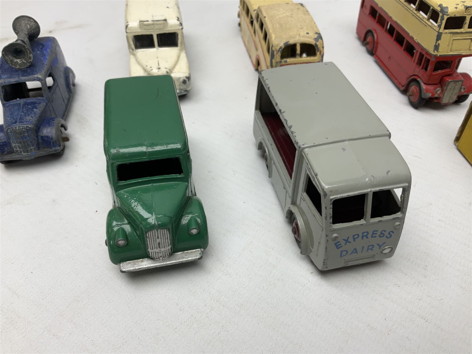 Dinky - Bedford 10cwt Van 'Kodak' No.480, boxed; and six unboxed and playworn models including Trojan Chivers Jellies van, loudspeaker van, Daimler Ambulance, N.C.B. Electric Van and two buses (7)